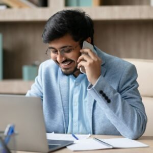 Indian professional man engages in business call in office interior